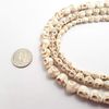 White Magnesite Turquoise Skull Size 10x12mm 15.5" Strand