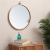 Pemberly Row 18" Round Mid-Century Metal Frame Hooked Mirror in Brass
