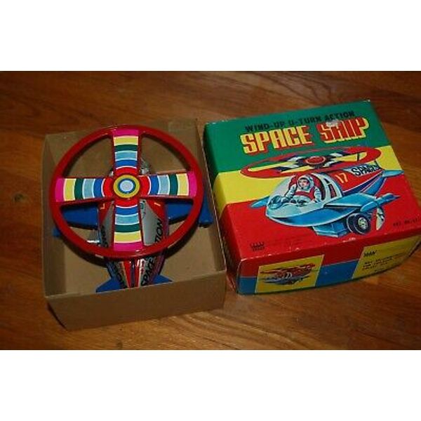 Wind up wind-up toy spaceship in box