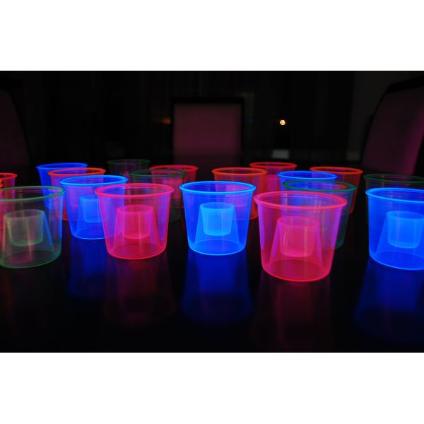 DIRECTGLOW LLC 4oz 20ct Assorted Blacklight Reactive Soft Plastic Bomber Shot Glasses