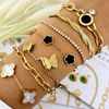 V.F Gem Co. - Elegant Black and Gold Clover Charm Bracelet
