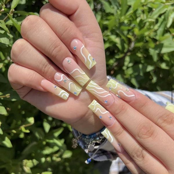 JUSTOTRY 24 Pcs White Swirl False Nails Long with Diamond,Pale Yellow French Press on Nails Patterns, Ballerina Stick on Nails for Women,Acrylic Coffin Fake Nails Medium for Nail Art