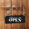 We are open or we are closed reversible sign with cord in black and red