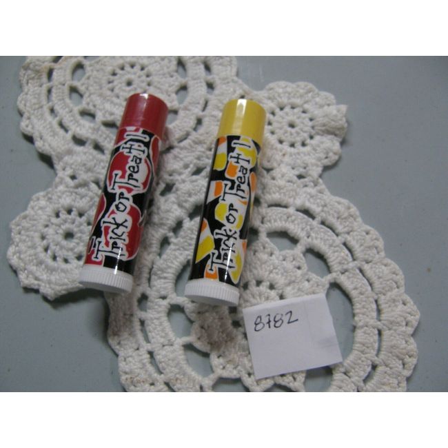 8782)2: Avon Trick or Treat Lip Balm Dunkin' Apple; Candy Corn UNSEALED OLDR STK