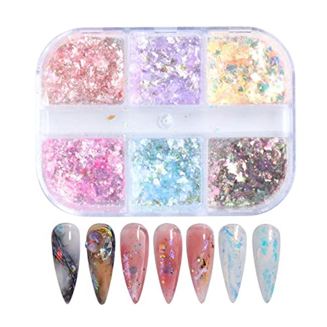 Crystal heart nail art with butterfly and glitter encapsulation. 