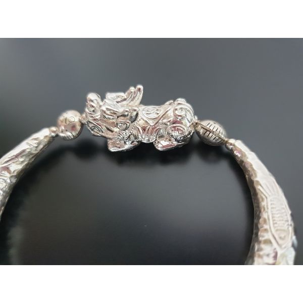 A traditional Korean souvenir handicraft sterling silver bracelet that gathers wealth