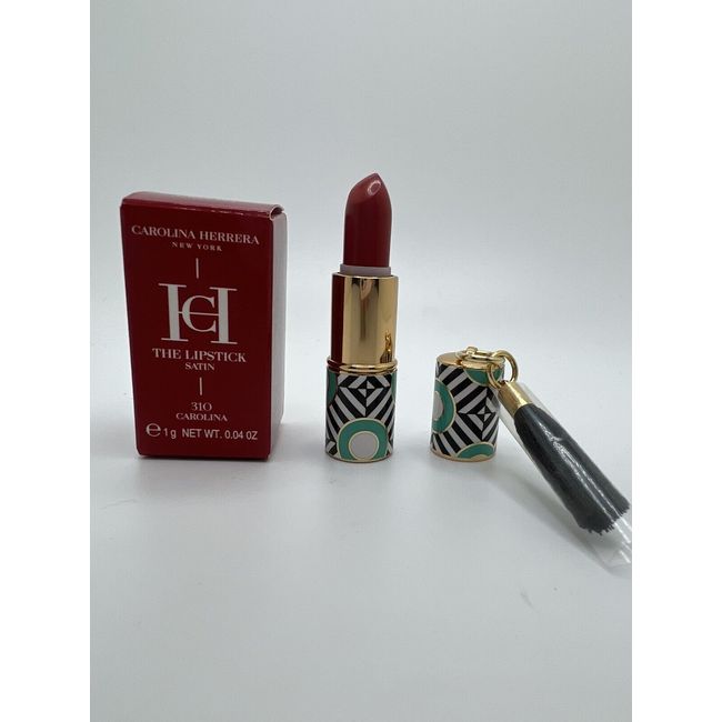 New CAROLINA HERRERA Satin lipstick #310, .04 oz, comes w/tassel charm TRAVEL