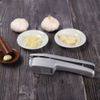 Compact Garlic Press: Effortless Mincing & Slicing with Cleaning Brush & Peeler