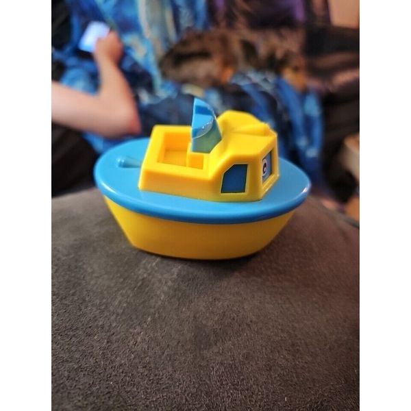 Unbranded Blue/ Yellow Toy Boat-4inches x 3inches.  Back Wheels Not Working