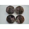 4 Paddington coins in sleeves. Uncirculated quality