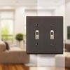 Amerelle Manhattan Double Toggle Cast Metal Wallplate in Aged Bronze