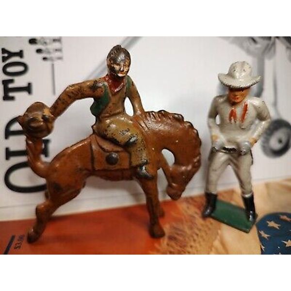 Grey Iron Cowboys Toy Figures