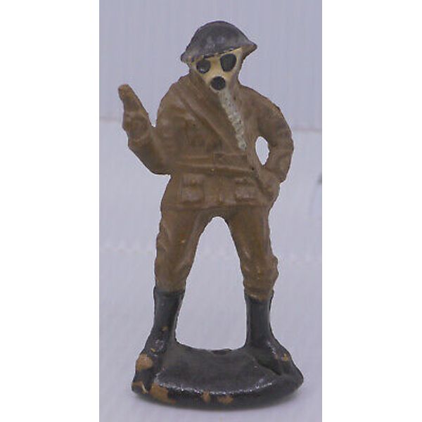 VINTAGE PAINTED COMPOSITION TOY SOLDIER WEARING GAS MASK, HOLDING PISTOL