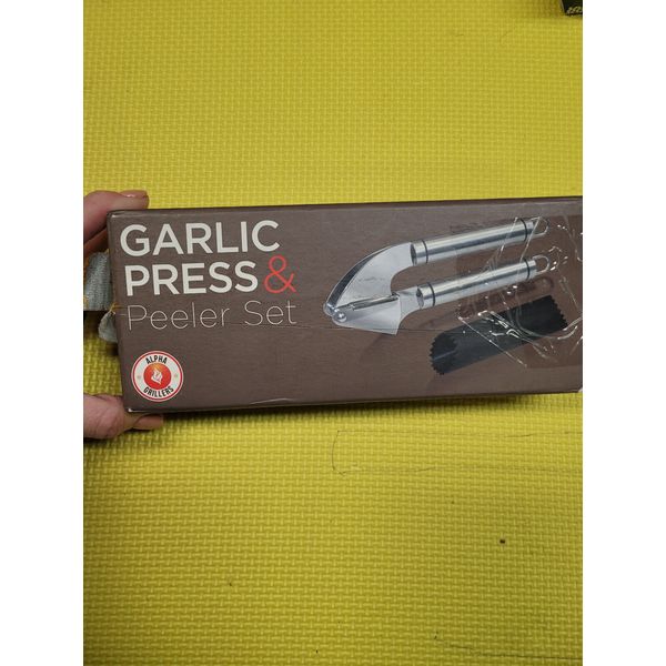 Stainless Steel Garlic Press and Peeler Set.