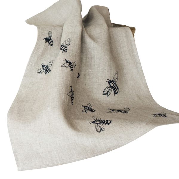 Helen Round Bee Tea Towel, Natural Linen. This beautiful, hand printed tea towel featuring bees is machine washable at 40 degrees and will compliment your kitchen decor perfectly. Size 70 x 46cm