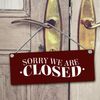 We are open or we are closed reversible sign with cord in black and red
