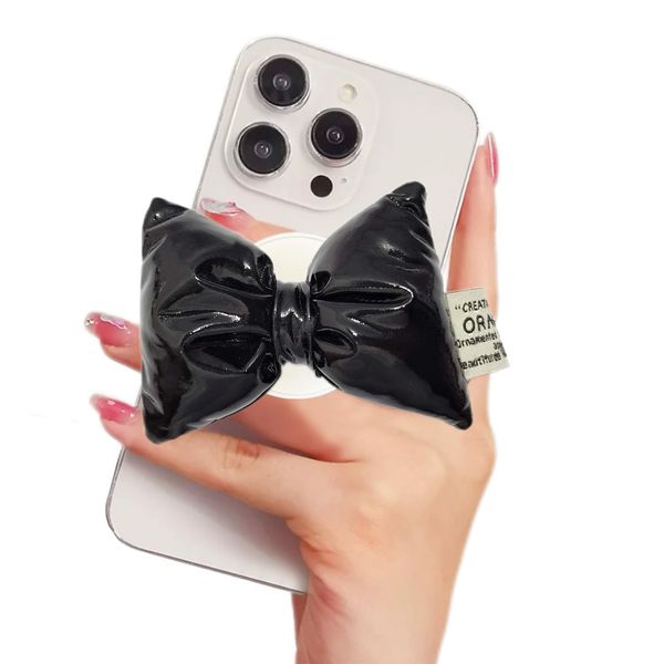 WUOJI Bowtie Shape Collapsible Expandable Multi Functional Mobile Phone Grip Stand, 360 Degrees Rotation Phone Ring Grip Stand Compatible with Most of The Phones, Tablet and Case (Black)