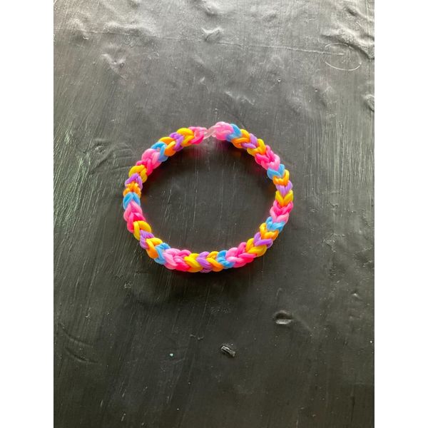 6.5 inch handmade rubber band loom bracelet. (Pink, blue, orange, and purple.)