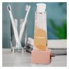 Andiker Rolling Tube Toothpaste Squeezer, 2 PiecesToothpaste Holder Stand Dispenser for Bathroom (White,Pink)